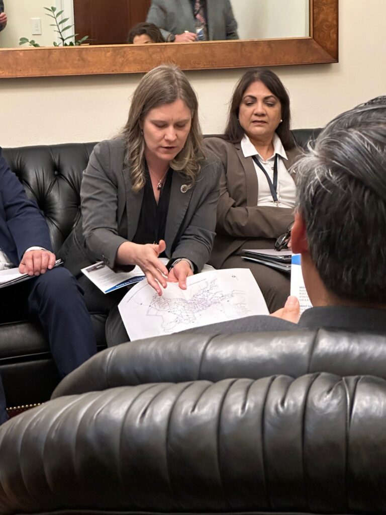 Neva Popenoe sharing a safety map with Congressman Fong